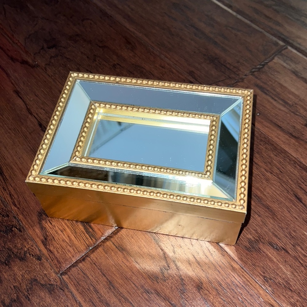 Rectangle gold metal & glass mirror design end lid that opens to a jewelry box​